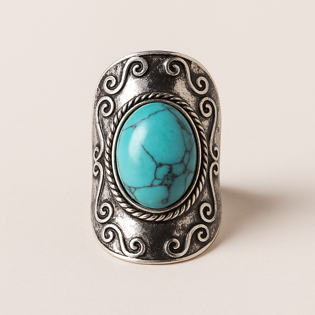 Boho ring met ovale turquoise steen – voorkant met rechthoekige vintage setting, Menikleding.
