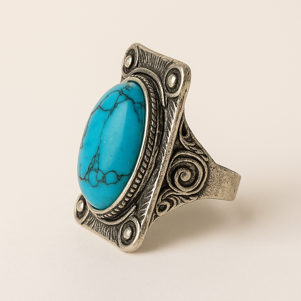 Zijaanzicht van boho ring met turquoise ovale steen en vintage zilverkleurige details